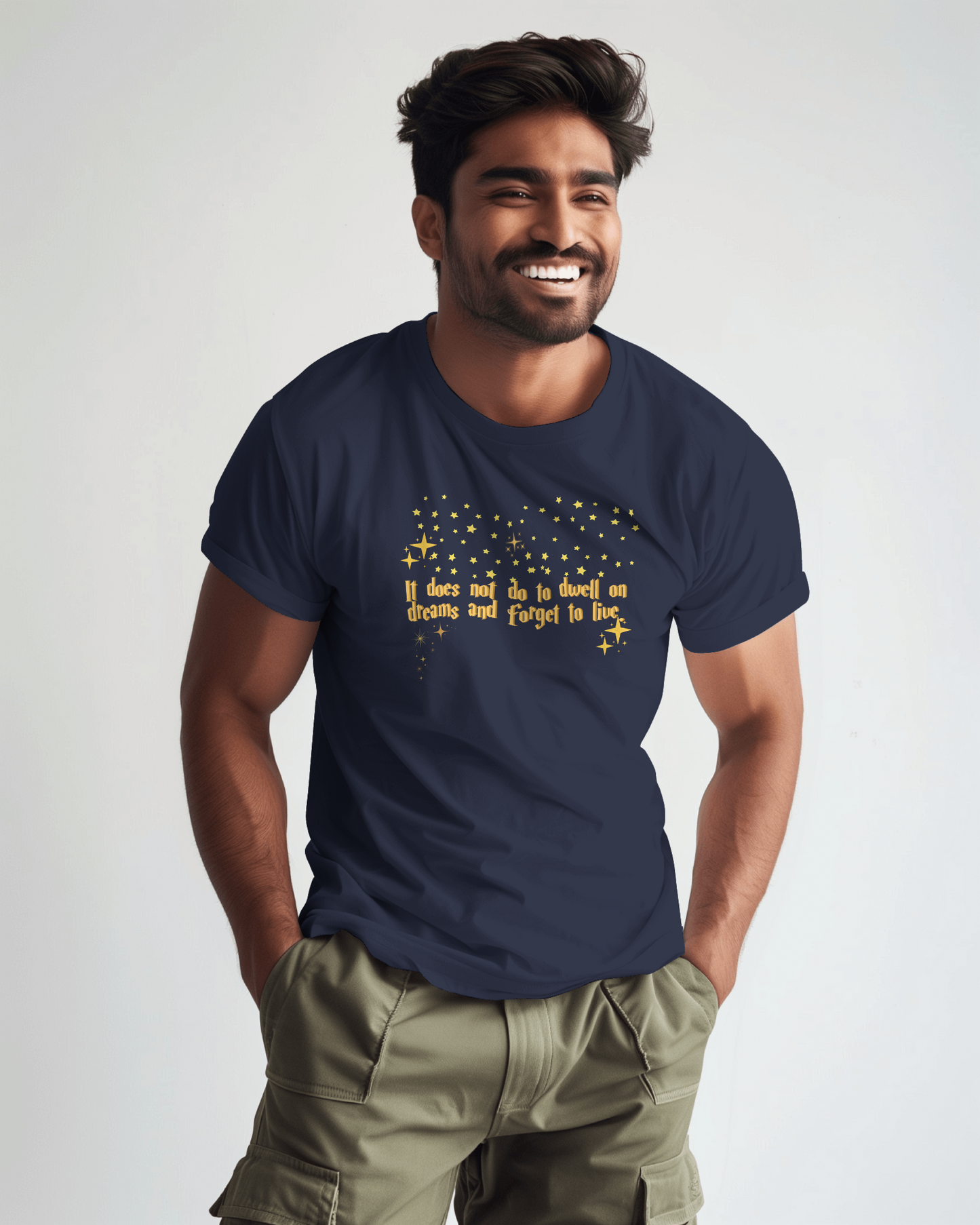 Man wearing a navy blue t-shirt with yellow text on a plain background, Dumbledore quote, harry potter