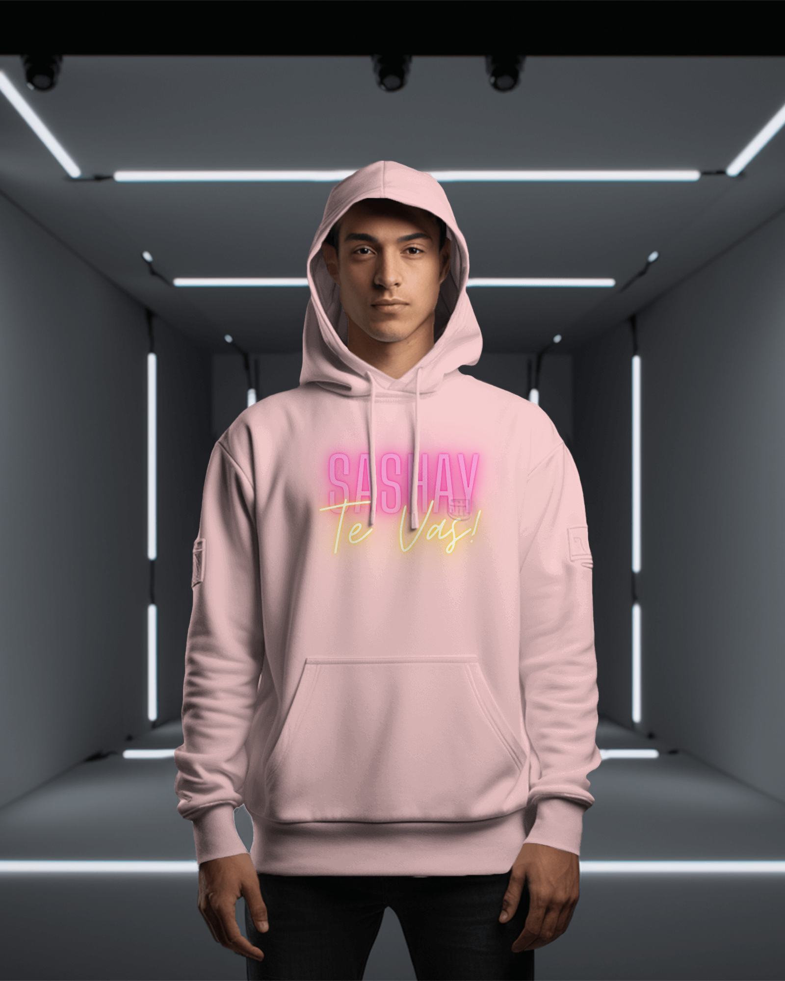 Person wearing a pink hoodie with text in a futuristic indoor setting  Drag Race Espana, Drag Race Spain, Rupaul's drag race, Drag queens, LGBT, Queer culture