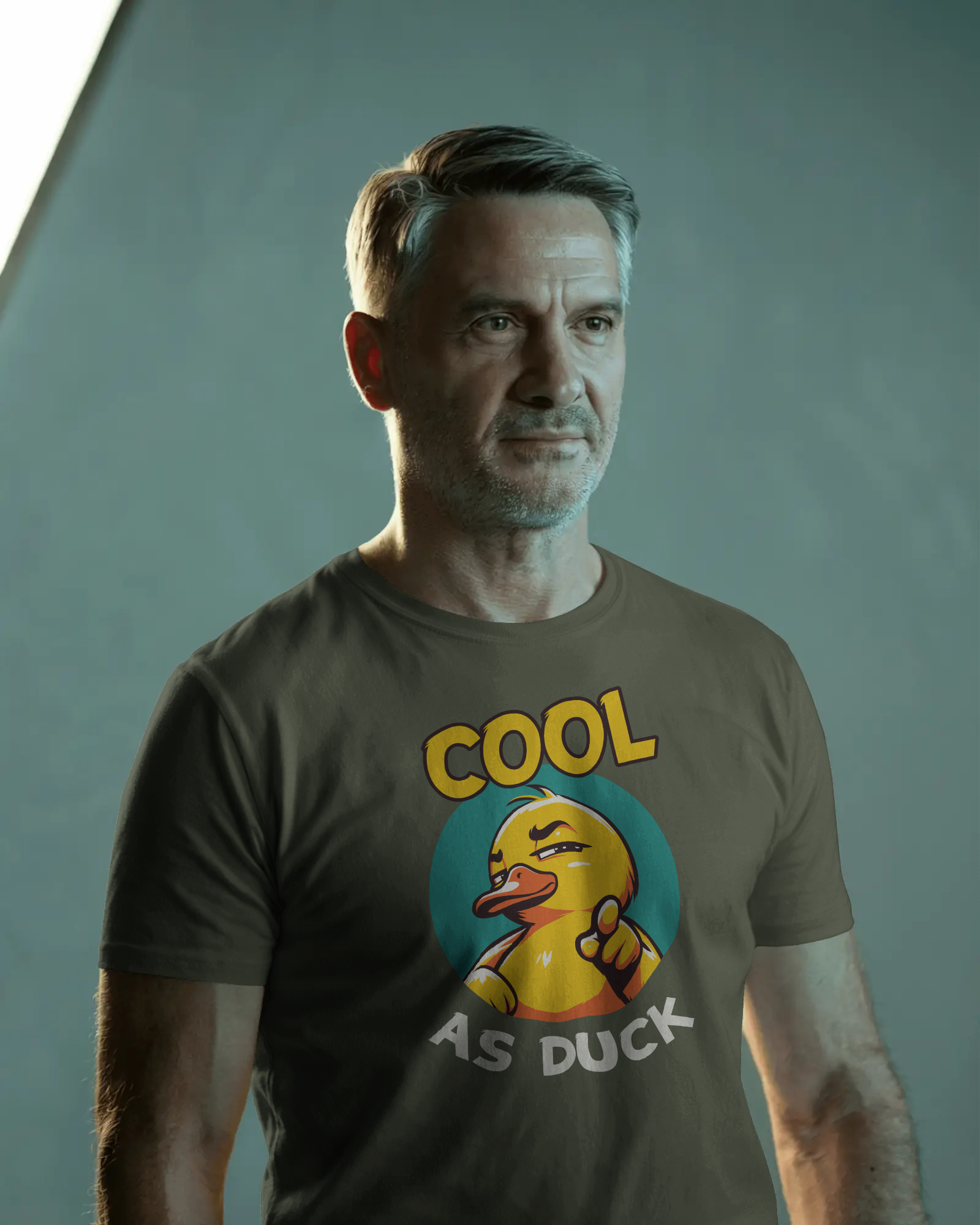 Man wearing a t-shirt with a duck graphic and text 'Cool as Duck' against a plain background