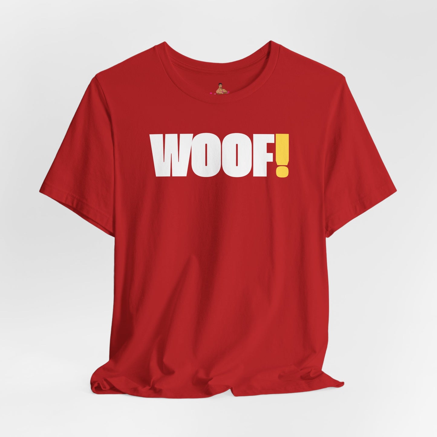 Man wearing a black t-shirt with 'WOOF!' text against a dark background LGBTQIA+ QUEER, Kink Positive