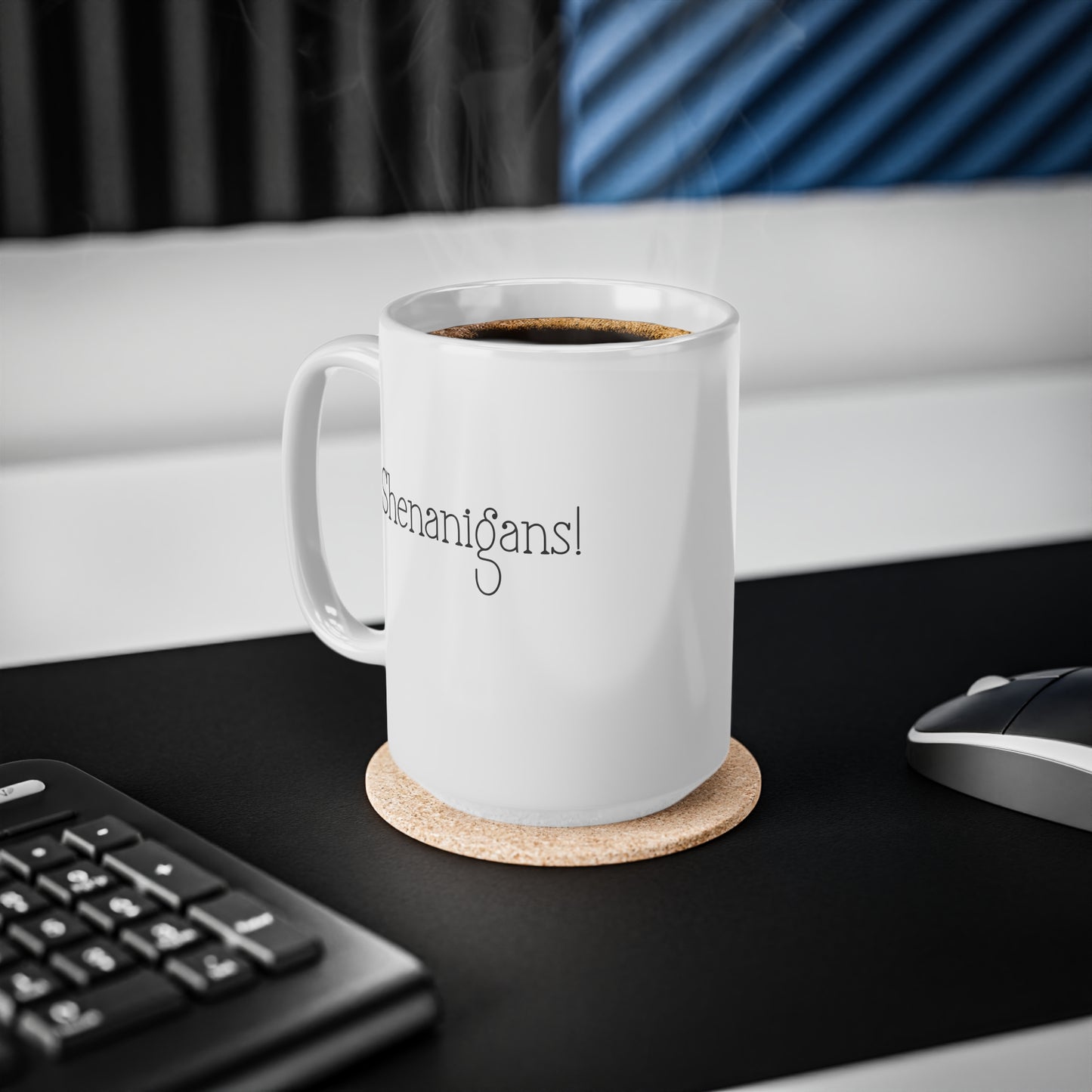 White mug with text on a coaster on a desk with a keyboard and mouse.