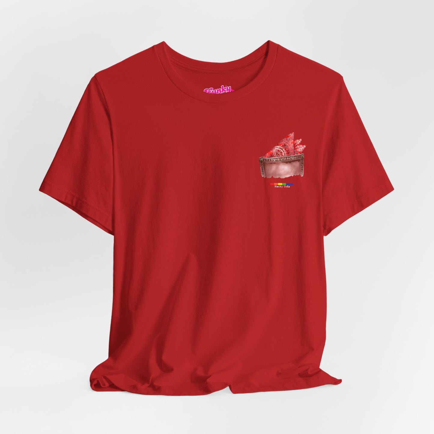 Red t-shirt with a small graphic of a pocket with a paisley print hanky tucked inside. it features the LGBT rainbow colours and the words Hanky Code