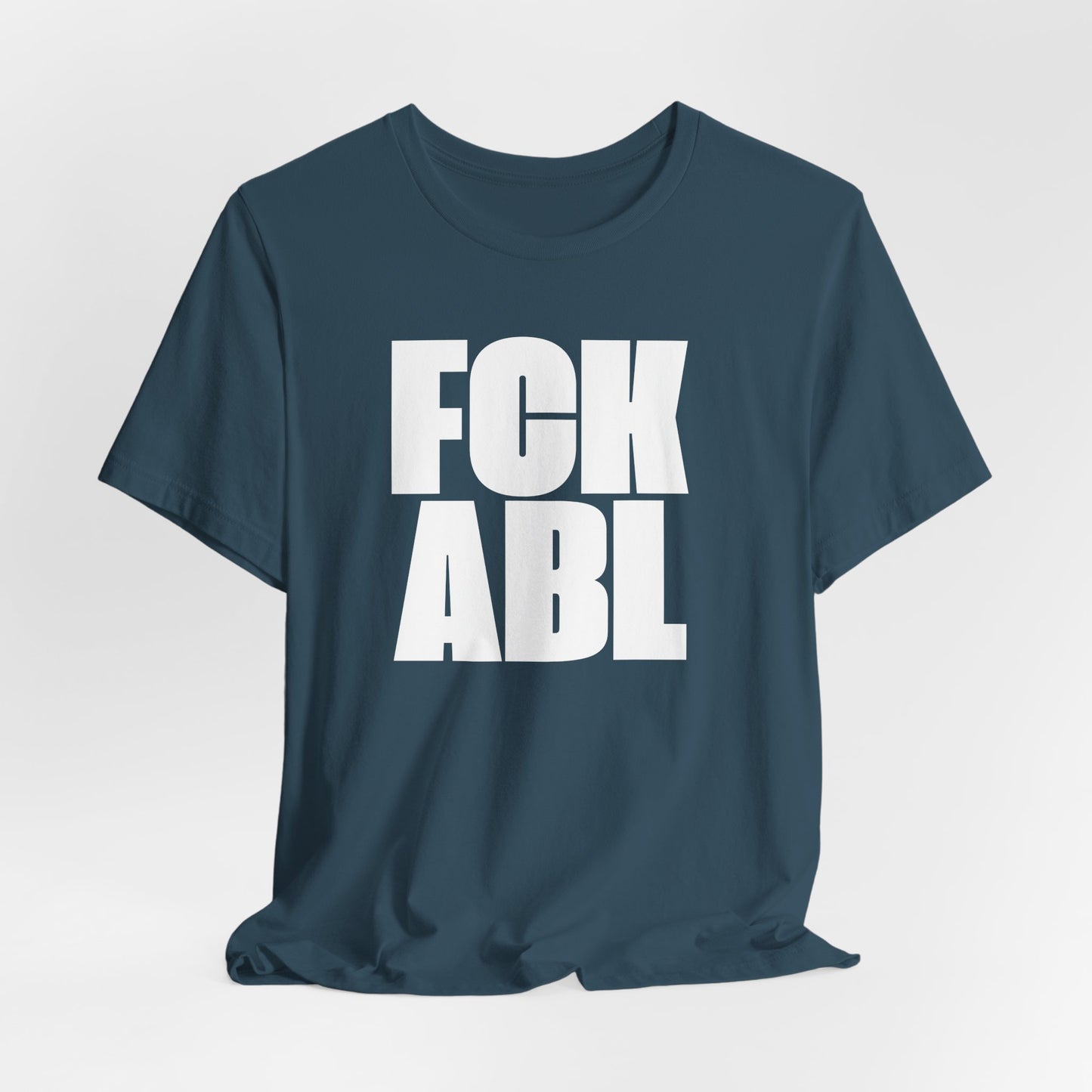 Navy blue t-shirt with white text 'FCK ABL' on a light gray background