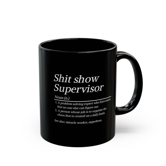 Black mug with white text on a white background
