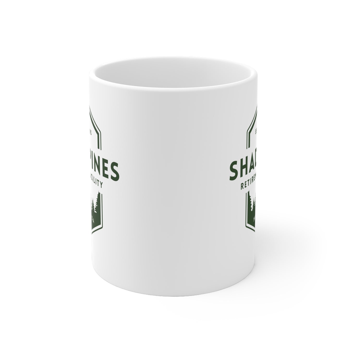 White mug with green text and graphics on a white background