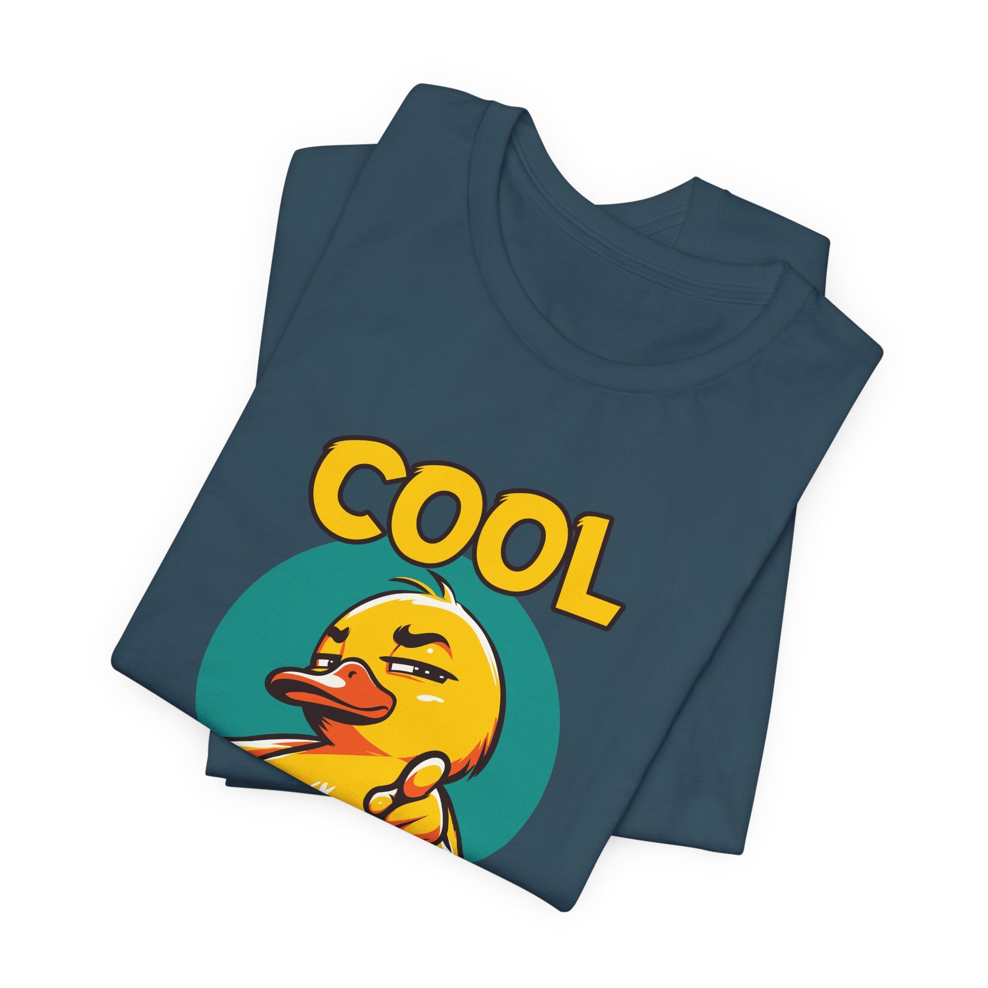 Folded blue t-shirt with a yellow duck and 'COOL' text on a white background