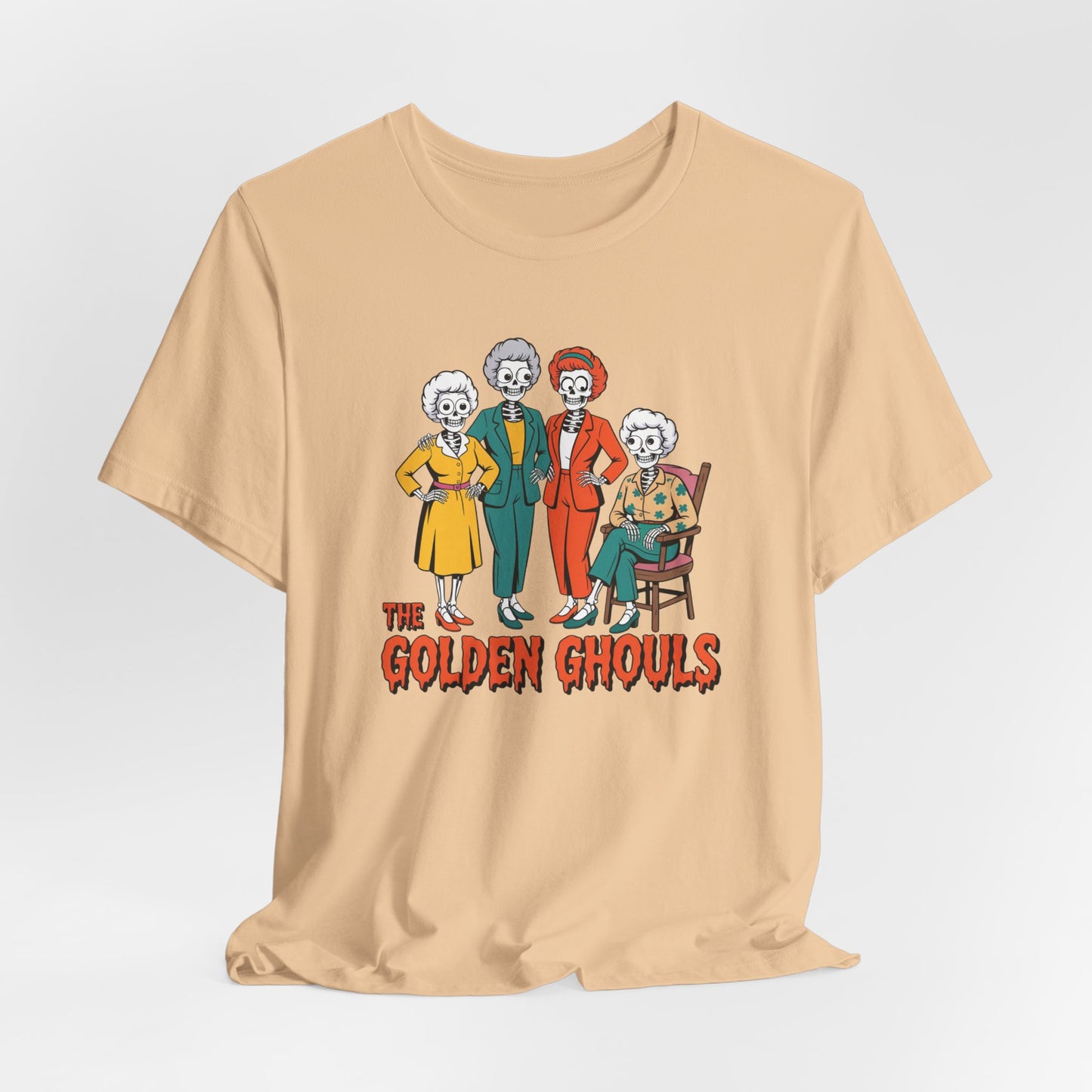 Beige t-shirt with 'The Golden Ghouls' graphic design on a light gray background   Golden Girls, 80s TV, Halloween Tees