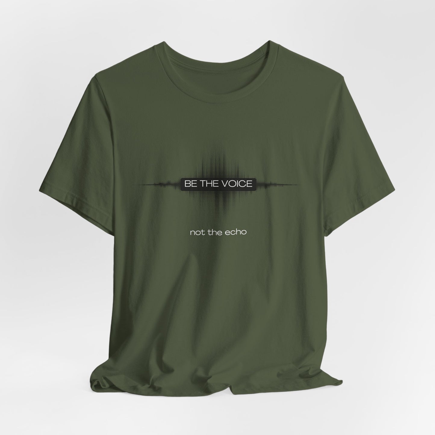 Green t-shirt with 'Be the Voice, not the Echo' text on a white background