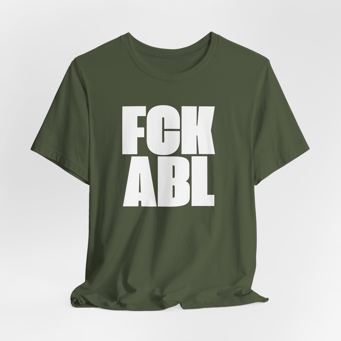 Green t-shirt with white text 'FCK ABL' on a light gray background