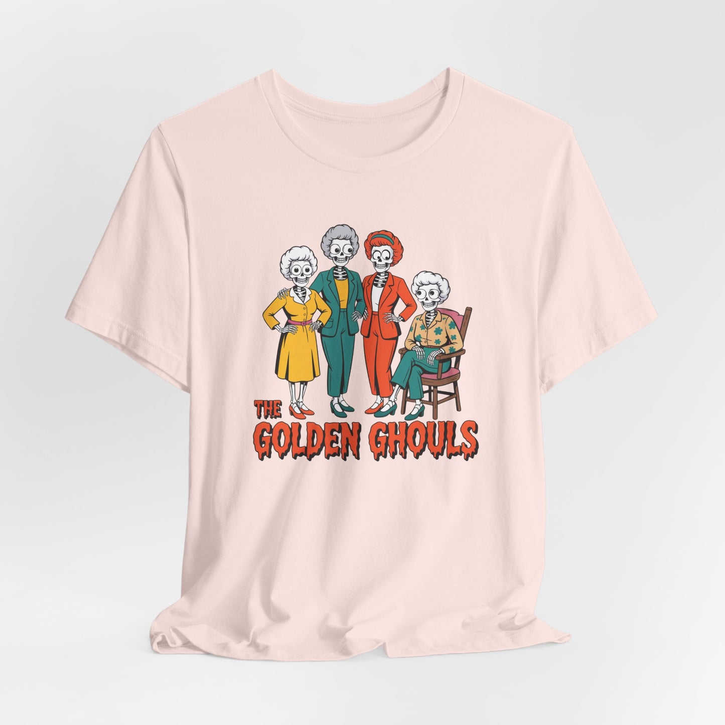 Pink t-shirt with 'The Golden Ghouls' graphic on a light gray background   Golden Girls, 80s TV, Halloween Tees