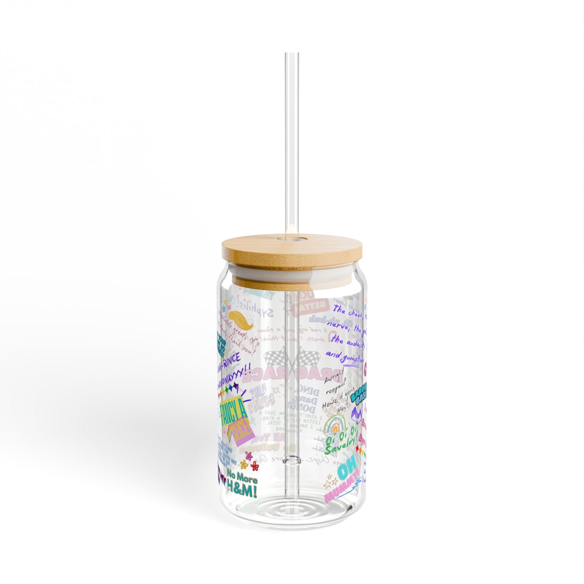 Clear tumbler with colorful text design, wooden lid, and straw on a white background Features iconic Quotes from your favorite Drag Race UK  Drag Queens.