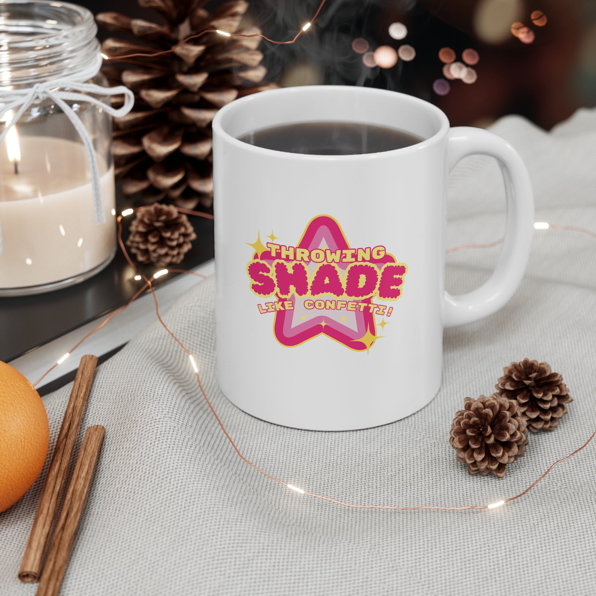 White mug with colorful text design on a table with decorative items Throwing Shade, Shade, Queer Culture, LGBT, GAY