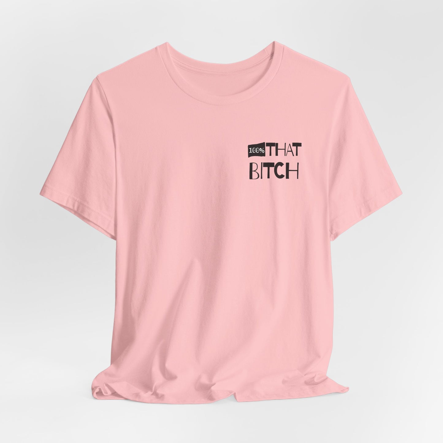 Pink t-shirt with text on a light gray background  100% that Bitch