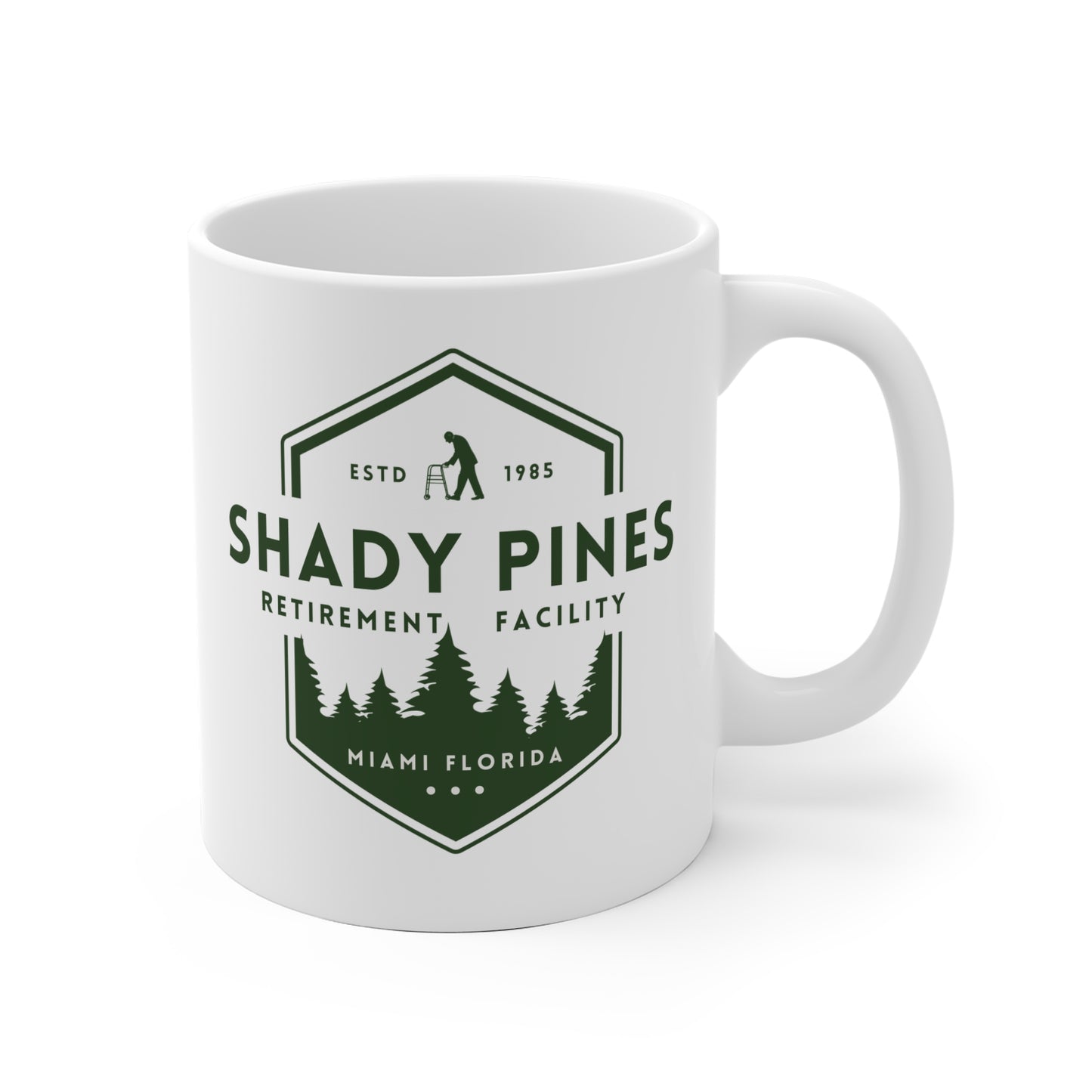 White mug with 'Shady Pines Retirement Facility' logo on a white background