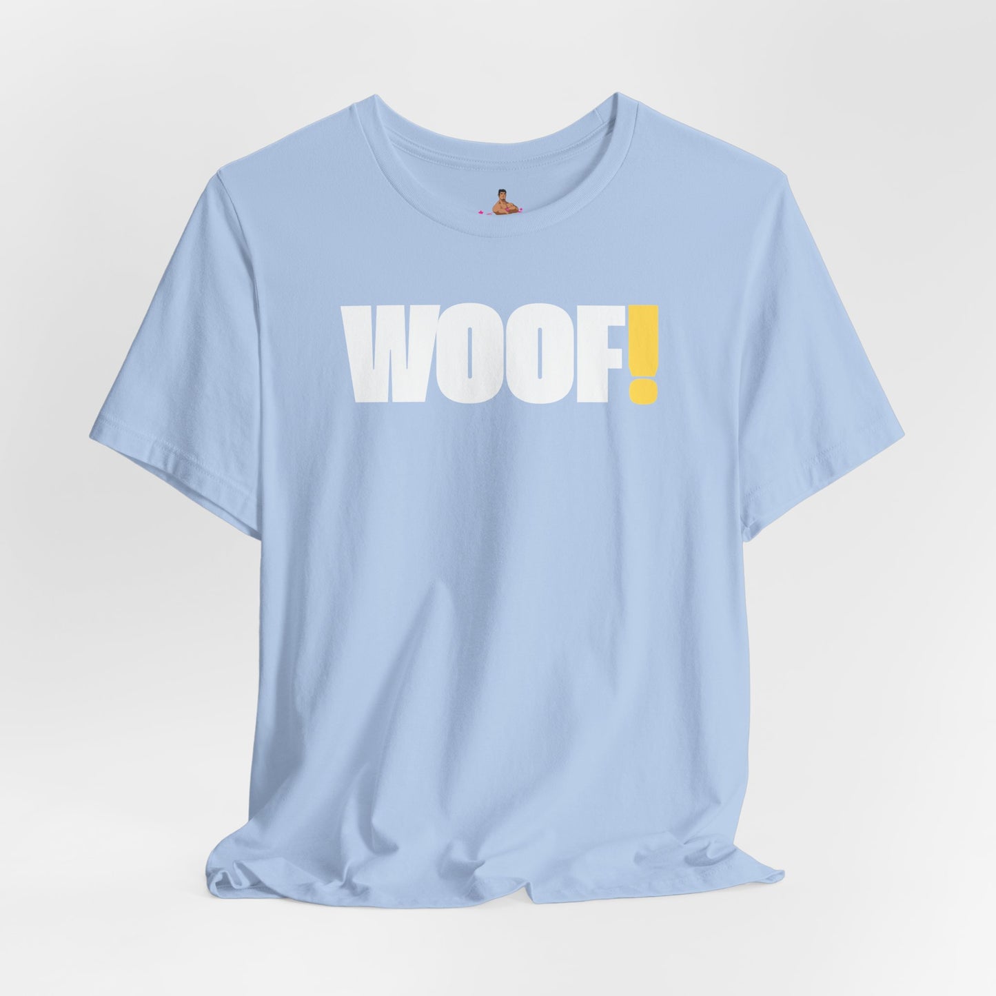 Man wearing a black t-shirt with 'WOOF!' text against a dark background LGBTQIA+ QUEER, Kink Positive