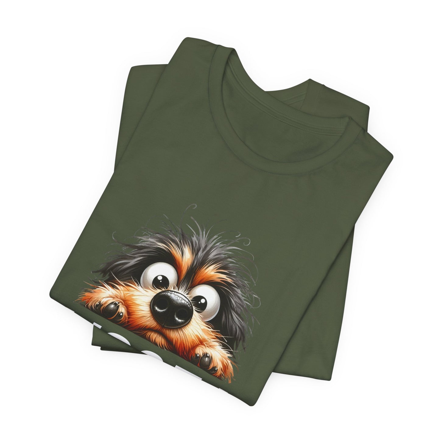 Folded green t-shirt with a cartoon dog face design on a white background